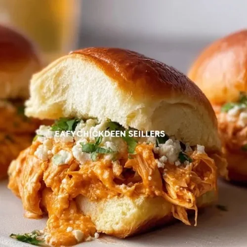 Delicious Easy Buffalo Chicken Sliders served on a platter with garnishes.